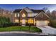 Charming two-story brick home with a well-manicured lawn and an attached two-car garage at 2835 Peverell Ln, Charlotte, NC 28270