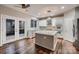 Bright kitchen with pendant lighting, hardwood floors, and stainless steel appliances at 2835 Peverell Ln, Charlotte, NC 28270