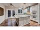 Contemporary kitchen featuring an island, stainless appliances, and hardwood floors at 2835 Peverell Ln, Charlotte, NC 28270