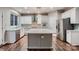 Stylish kitchen with an island, hardwood floors, and stainless steel appliances at 2835 Peverell Ln, Charlotte, NC 28270