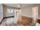 Open-concept living room with hardwood floors and seamless flow to the kitchen at 2835 Peverell Ln, Charlotte, NC 28270