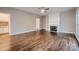 Spacious living room with a fireplace, hardwood floors, and natural light at 2835 Peverell Ln, Charlotte, NC 28270