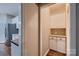 A well-organized pantry with granite countertops, white cabinets and hardwood floors at 2835 Peverell Ln, Charlotte, NC 28270