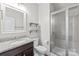 Bathroom features a vanity with granite countertop, glass-enclosed shower, and modern fixtures at 3017 Woodlands Creek Dr, Monroe, NC 28110
