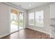 Breakfast area with hardwood floors, sliding glass doors to patio, and neutral paint at 3017 Woodlands Creek Dr, Monroe, NC 28110