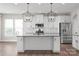 Modern kitchen with granite countertops, stainless steel appliances, and white cabinetry at 3017 Woodlands Creek Dr, Monroe, NC 28110