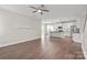 Open-concept living area flows into a kitchen with modern lighting and stainless steel appliances at 3017 Woodlands Creek Dr, Monroe, NC 28110