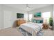 Bright, spacious bedroom with plush bedding, large windows, and stylish decor at 3017 Woodlands Creek Dr, Monroe, NC 28110