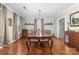 Traditional dining room featuring a dark wood table with seating for eight under a decorative chandelier at 308 W First St, Lowell, NC 28098