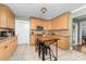 Eat-in kitchen featuring stainless steel appliances, custom cabinets and a breakfast bar island with seating at 308 W First St, Lowell, NC 28098
