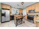 Eat-in kitchen featuring stainless steel appliances, custom cabinets and a breakfast bar island with seating at 308 W First St, Lowell, NC 28098