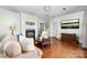 Comfortable living room boasts a fireplace, hardwood floors, and a mounted flat screen television at 308 W First St, Lowell, NC 28098