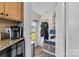 Mud room near kitchen with storage bench, hooks for coats and access to the backyard at 308 W First St, Lowell, NC 28098
