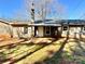 Spacious backyard with trees and grassy area, featuring the back of the home at 3807 Woodlawn St, Sharon, SC 29742