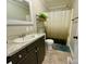Bathroom featuring a vanity, toilet, shower with curtain, and neutral flooring at 3807 Woodlawn St, Sharon, SC 29742