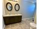 Bathroom features dual sinks, framed mirrors, and dark wood cabinetry at 3807 Woodlawn St, Sharon, SC 29742
