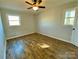 A bright bedroom features new carpet and neutral walls and trim at 3807 Woodlawn St, Sharon, SC 29742