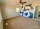 Bedroom with carpeted floor, ceiling fan and a unique geometric patterned accent wall at 3807 Woodlawn St, Sharon, SC 29742