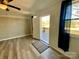 Entryway features a front door, adjacent window with natural light, and sleek wood-look floors at 3807 Woodlawn St, Sharon, SC 29742