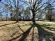Charming single-story home featuring a two-car garage nestled among mature trees on a large lot at 3807 Woodlawn St, Sharon, SC 29742