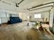 Large two car garage with concrete floor, storage, and windows for natural light at 3807 Woodlawn St, Sharon, SC 29742
