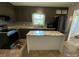 The kitchen features updated stainless steel appliances and a white island with stone countertop at 3807 Woodlawn St, Sharon, SC 29742