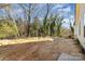 Unfinished backyard with trees, wood, and a view of the surrounding woods at 42 Magnolia St, York, SC 29745