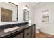 Bathroom featuring a double vanity with modern black fixtures and marble countertop at 42 Magnolia St, York, SC 29745