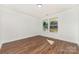 Bright bedroom with hardwood floors and two windows offering great natural light at 42 Magnolia St, York, SC 29745