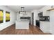 Modern kitchen with white cabinetry, stainless appliances, and a granite island providing great features at 42 Magnolia St, York, SC 29745