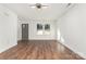 Inviting living room featuring wood floors and bright windows near the entry door at 42 Magnolia St, York, SC 29745