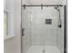 Modern bathroom featuring an enclosed glass shower with white subway tile and black trim at 42 Magnolia St, York, SC 29745