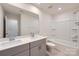 Bathroom featuring double sinks, modern fixtures, and a shower and tub combination at 428 Nixon Rd, Belmont, NC 28012