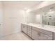 Bathroom featuring double sinks, modern fixtures, and a glass-enclosed shower at 428 Nixon Rd, Belmont, NC 28012