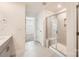 Bathroom featuring glass shower enclosure, modern fixtures, and neutral tile flooring at 428 Nixon Rd, Belmont, NC 28012