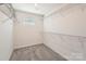 Walk-in closet featuring wire shelving and neutral carpet, providing ample storage space at 428 Nixon Rd, Belmont, NC 28012