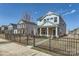 Charming two-story home with a well-manicured front yard and black metal fence at 428 Nixon Rd, Belmont, NC 28012