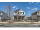 Inviting two-story home with a charming front yard and secure black metal fence at 428 Nixon Rd, Belmont, NC 28012