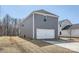 A detached two-car garage with a concrete driveway offers ample parking and storage space at 428 Nixon Rd, Belmont, NC 28012