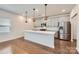 Modern kitchen with a large island, stainless steel appliances, and stylish pendant lighting at 428 Nixon Rd, Belmont, NC 28012