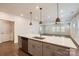 Open-concept kitchen with an island and stainless-steel appliances flowing into the living room at 428 Nixon Rd, Belmont, NC 28012