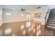 Bright, open-concept living room with hardwood floors and a view of the modern kitchen at 428 Nixon Rd, Belmont, NC 28012