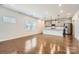 Open-concept living space featuring hardwood floors, recessed lighting, and view of modern kitchen at 428 Nixon Rd, Belmont, NC 28012