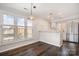 Bright dining area with natural light, hardwood floors, and stainless steel kitchen appliances at 433 W 8Th St, Charlotte, NC 28202