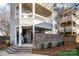 Charming condo exterior featuring brick accents, a covered porch, and well-maintained landscaping at 433 W 8Th St, Charlotte, NC 28202