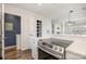 Modern kitchen featuring stainless steel appliances, quartz countertops, and an open layout into the living space at 433 W 8Th St, Charlotte, NC 28202