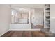 Living room and kitchen, with hardwood floors and neutral color palette with modern lighting fixtures at 433 W 8Th St, Charlotte, NC 28202