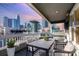 Relaxing patio with comfortable seating and a stunning view of the city skyline at sunset at 433 W 8Th St, Charlotte, NC 28202