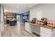 Finished basement with snack bar and built-in shelving for entertaining at 4335 Piper Glen Dr, Charlotte, NC 28277