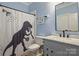 bathroom with gray vanity and a dinosaur shower curtain at 4335 Piper Glen Dr, Charlotte, NC 28277